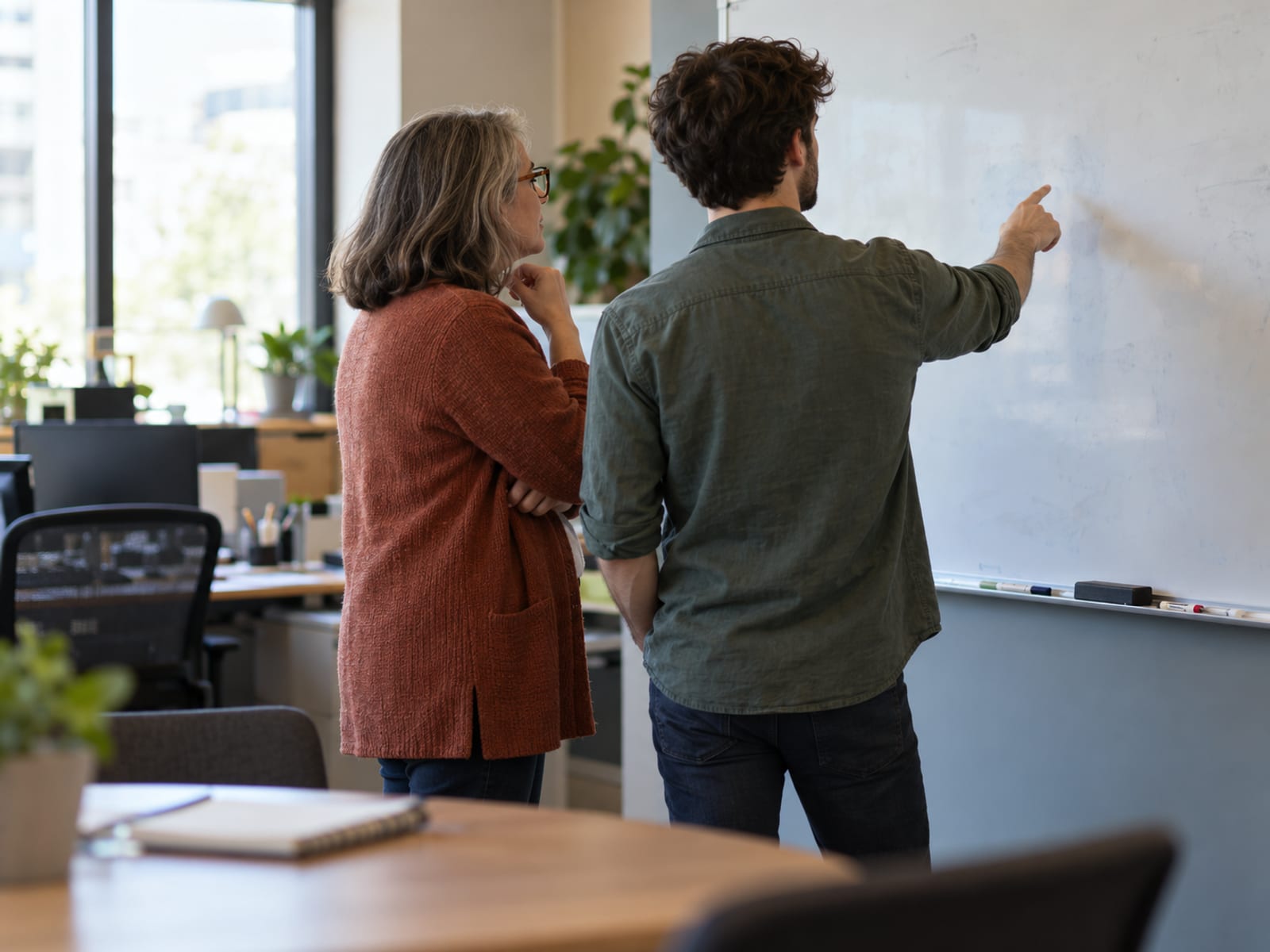 An employee and a manager deciding together what comes first